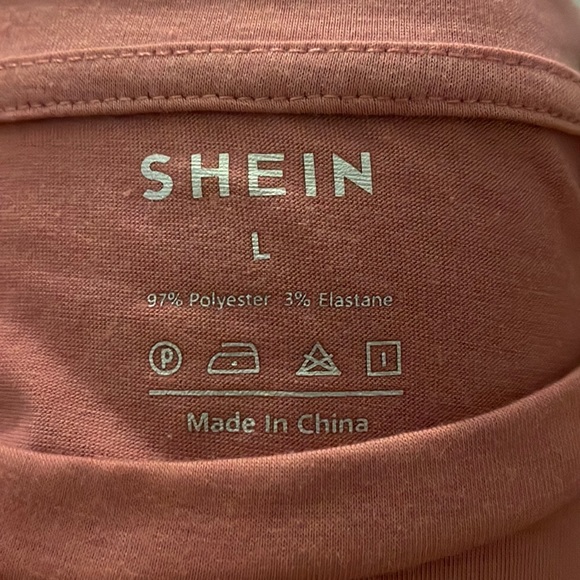 This is a large short sleeve t-shirt from SHEIN and is a light pink color. - Picture 3 of 4